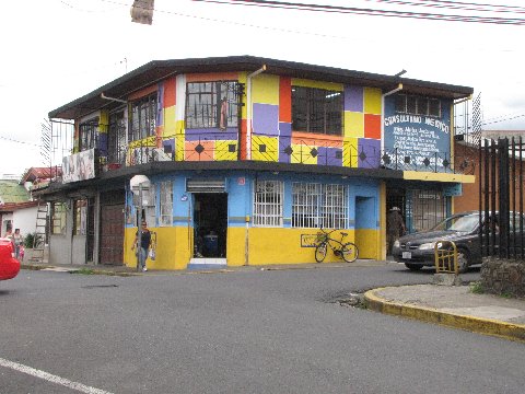 a house painted with many colors and stripes
