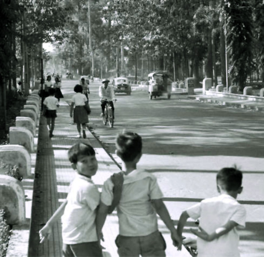 black and white po of people on a bridge