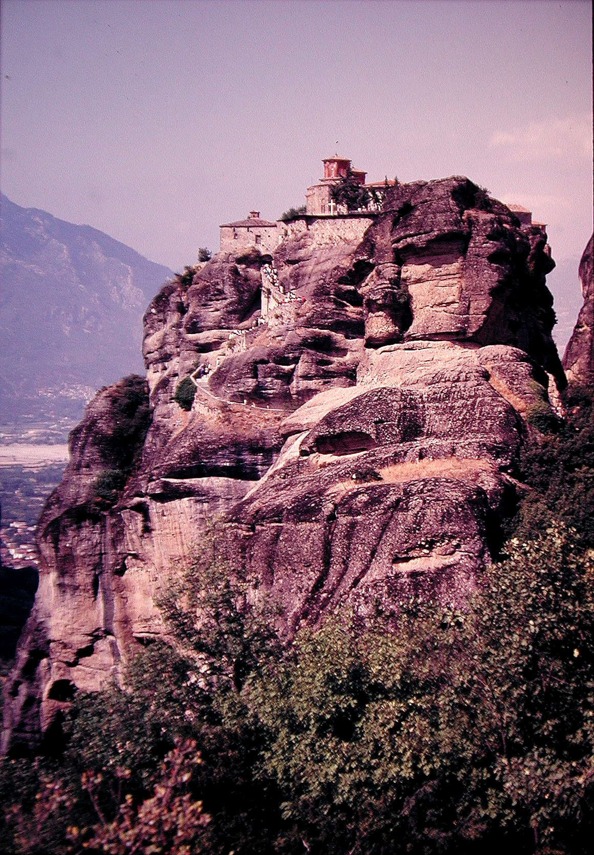 a mountain scene with an old castle on it