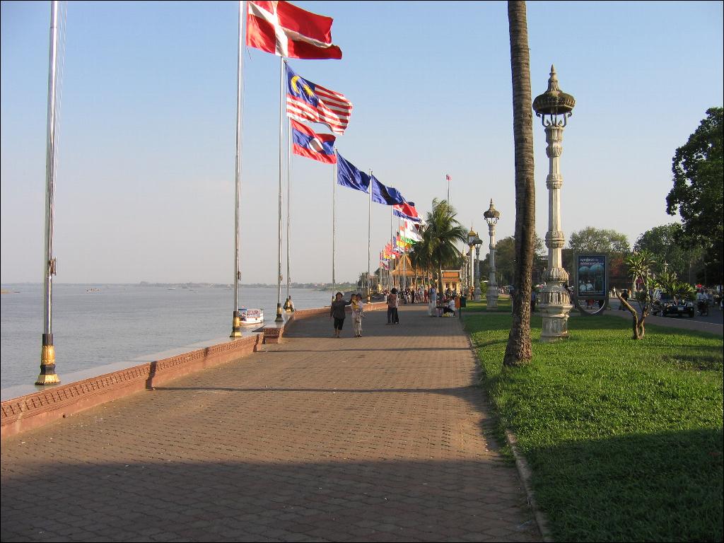 a brick path with many flags on top of it