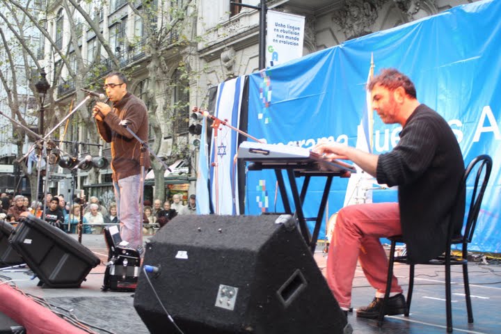 two men playing instruments on the street