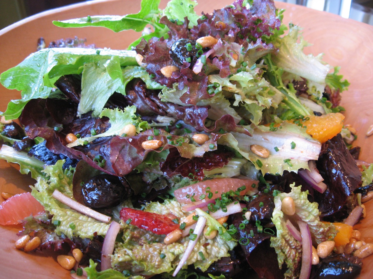 an image of a plate of salad with nuts