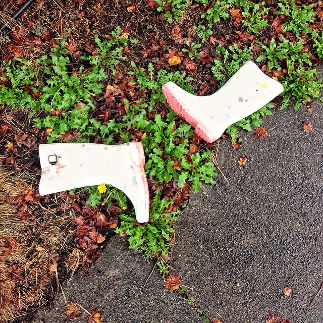 two broken white plastic objects on the ground