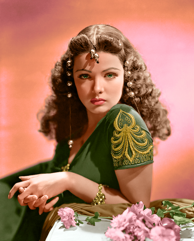 a woman with curly hair sitting down