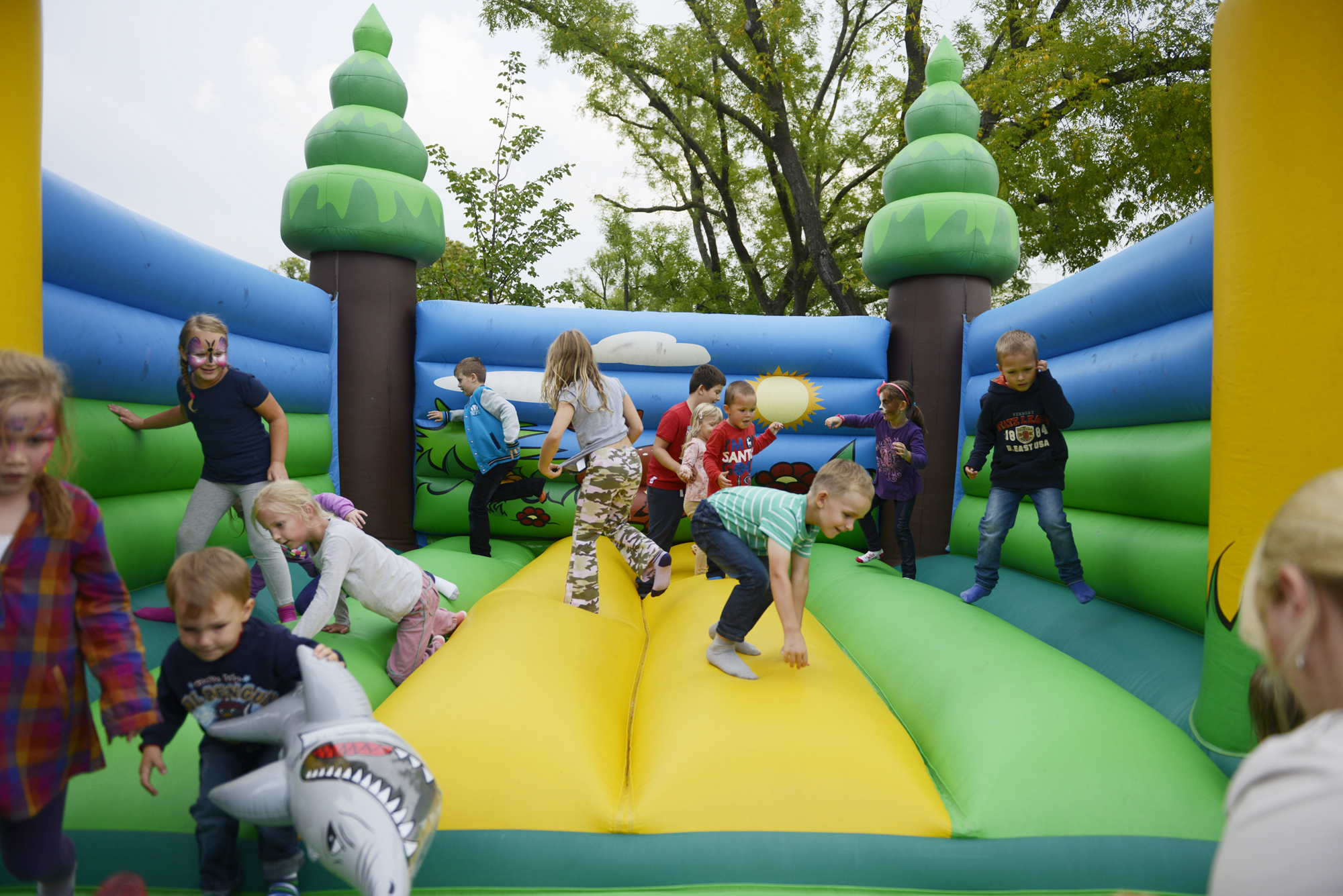 a group of children are in an obstacle park
