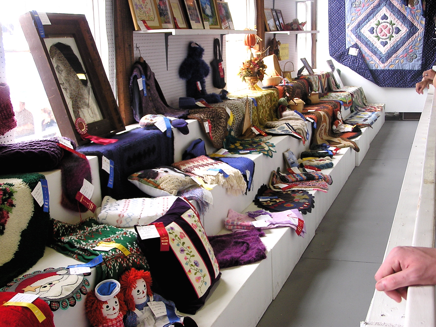 a counter in a room filled with lots of cloth