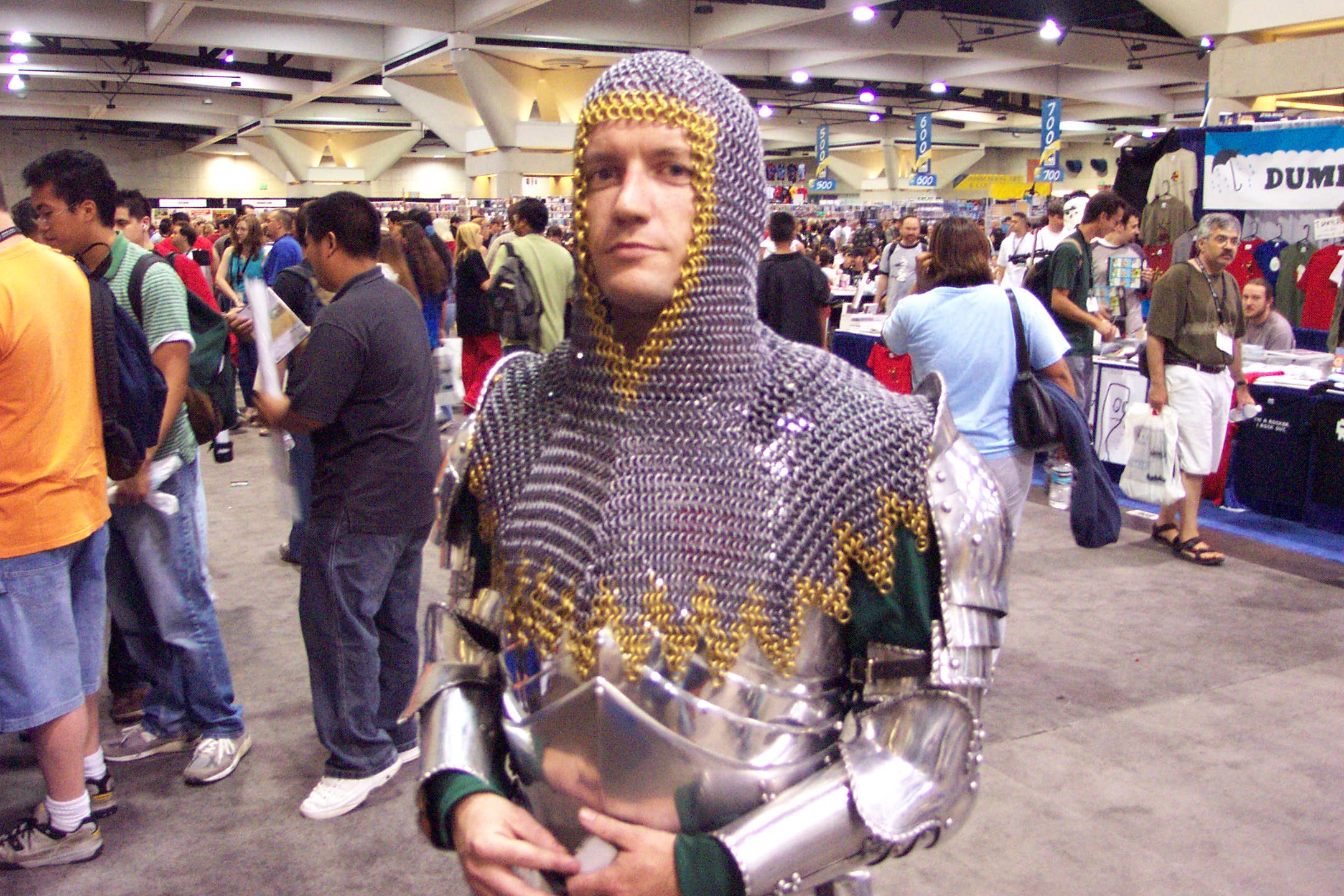 a man dressed in armor at a convention