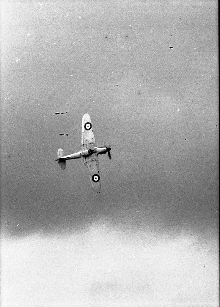 an airplane flying in the sky during a cloudy day