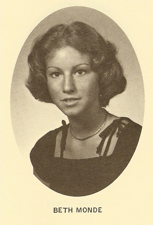 a lady with a bow around her neck