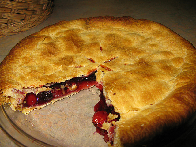 a pie that has been cut open and is being eaten