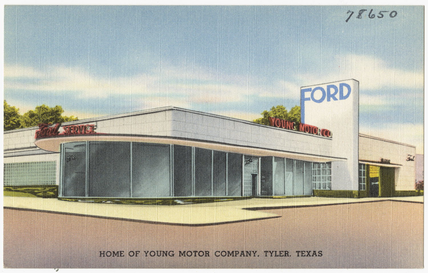 an old postcard shows the front entrance to a motor shop