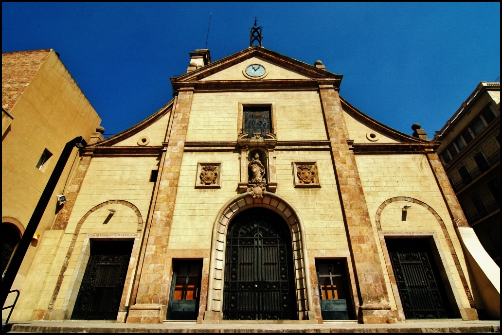 the building's entrance is surrounded by black doors