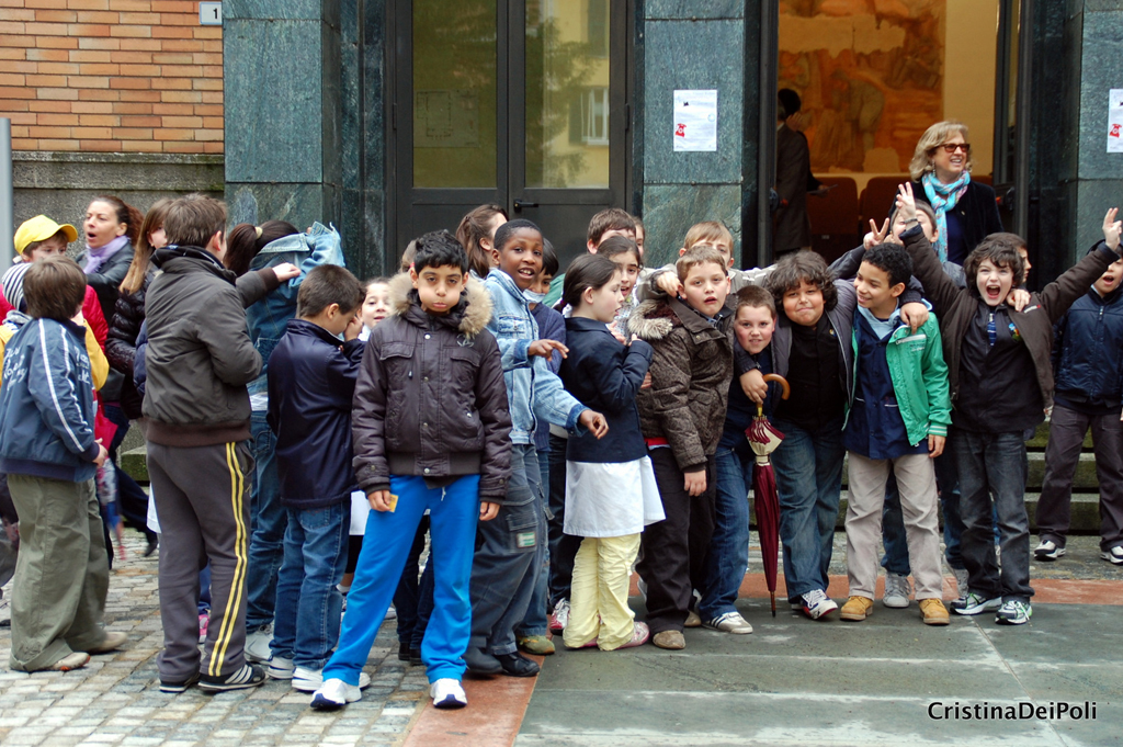 several people standing on either side of a large doorway