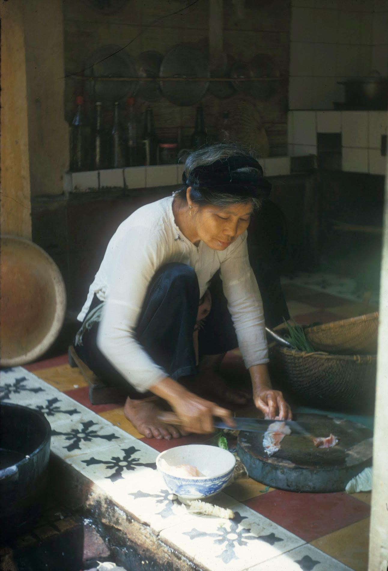 a woman in white shirt  food on table