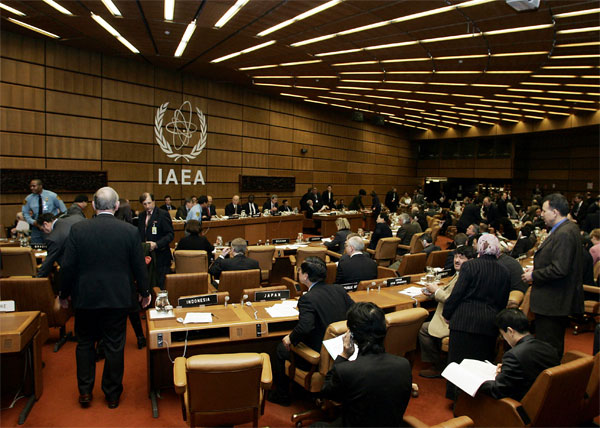 the room is filled with people and wearing black suits