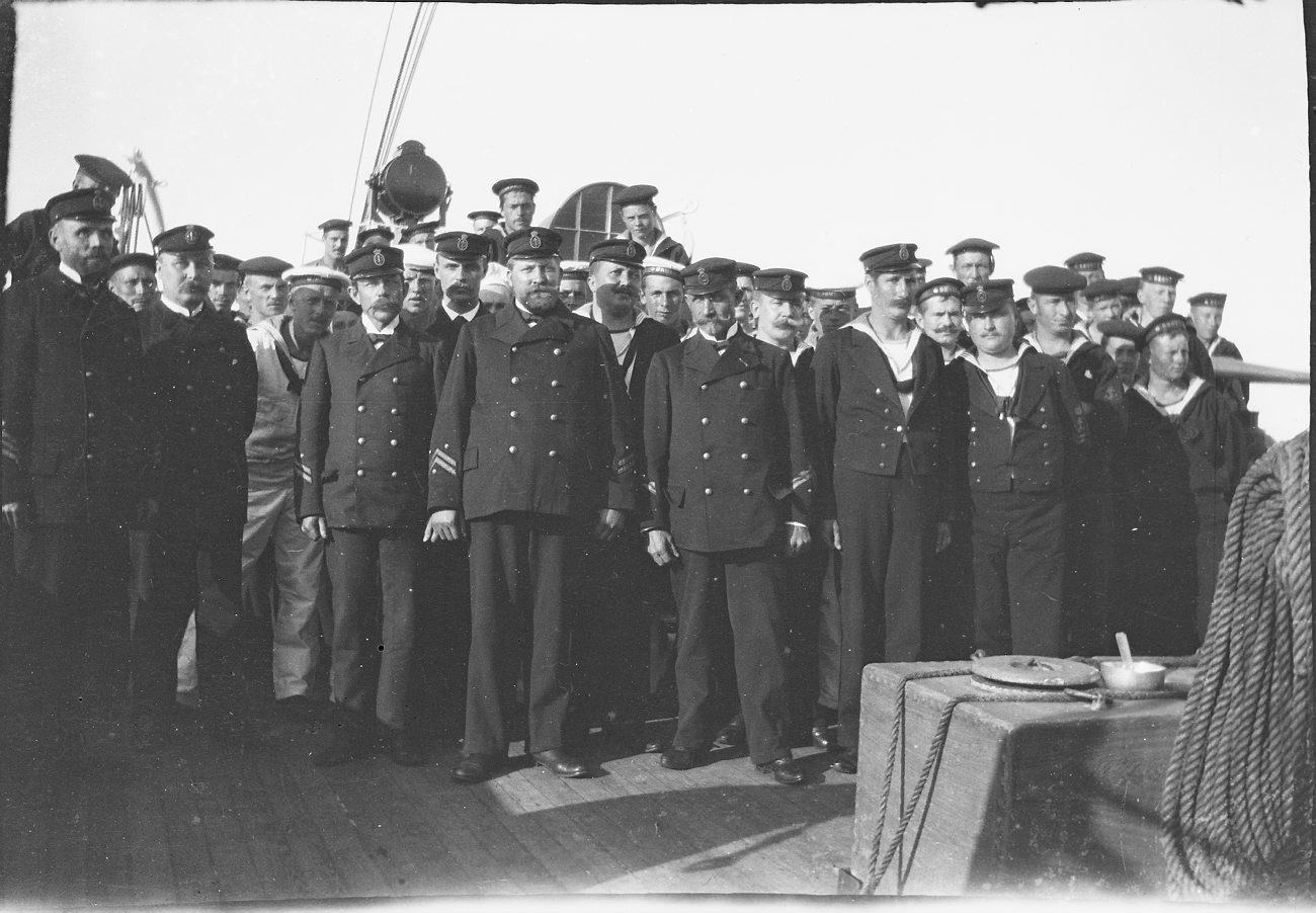 a crew of sailors are posing for a picture