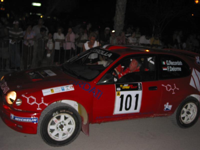 a rally car that is red with number 101