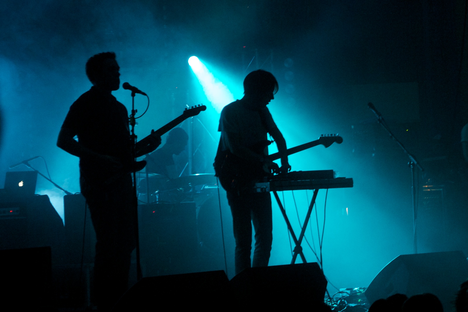 a band performing at a concert in the dark