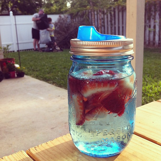 a glass jar of water has food in it