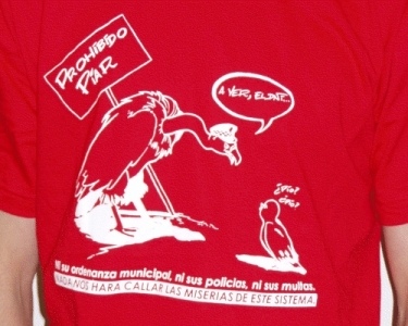 a man standing wearing a red tshirt with an eagle talking to his friend