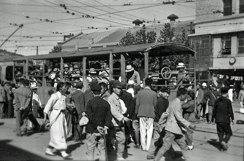 a group of people walking down the street