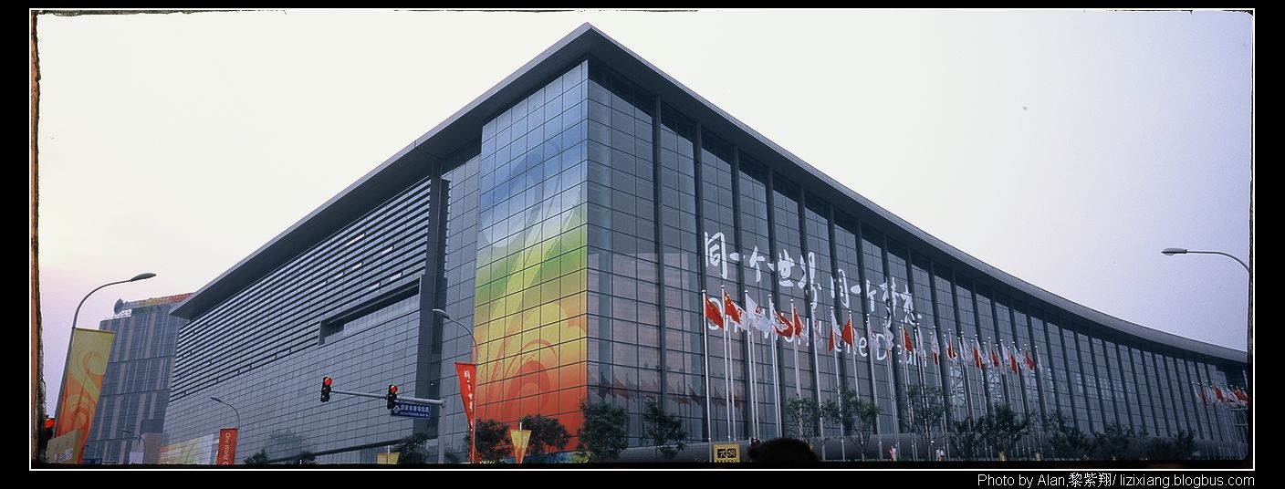 a glass building with lots of colors on it