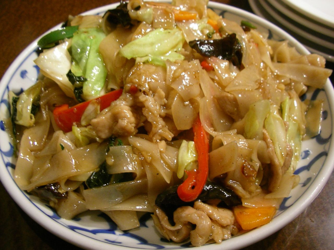 a plate with noodles and vegetables on it