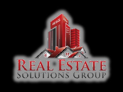 the real estate logo on black background