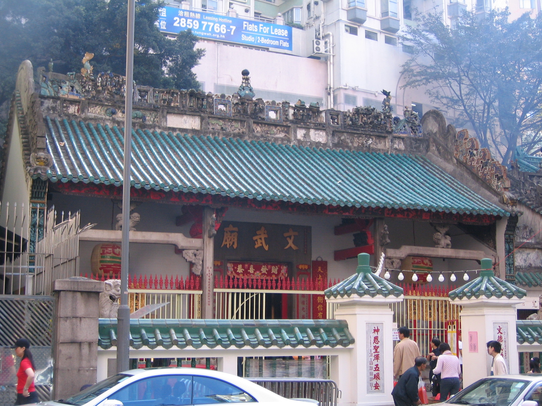 an oriental restaurant on the corner of a busy street