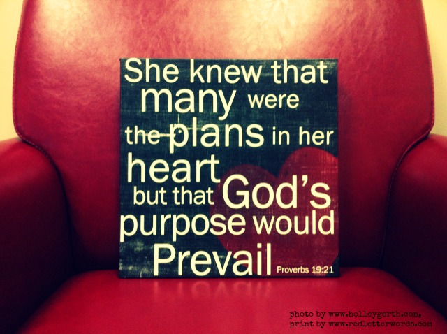 a sign on a chair that reads she knew that many were the plans in her heart but that god's purpose would prevail