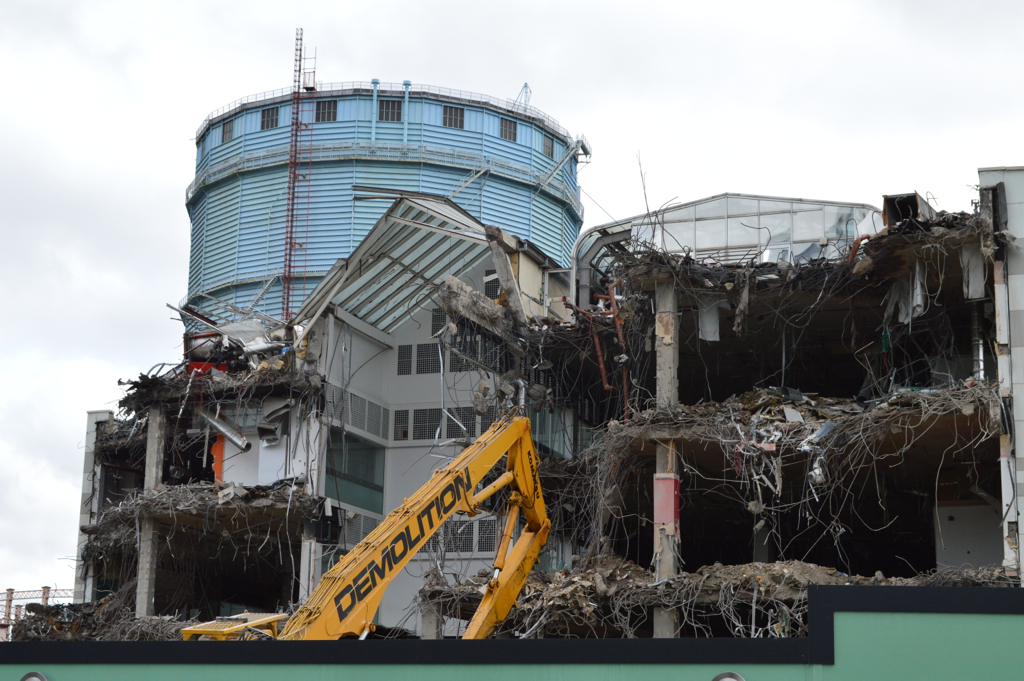 a large building that is under construction with lots of rubble on the outside