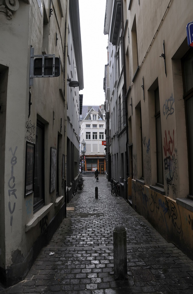 a city street that is very narrow and very dirty