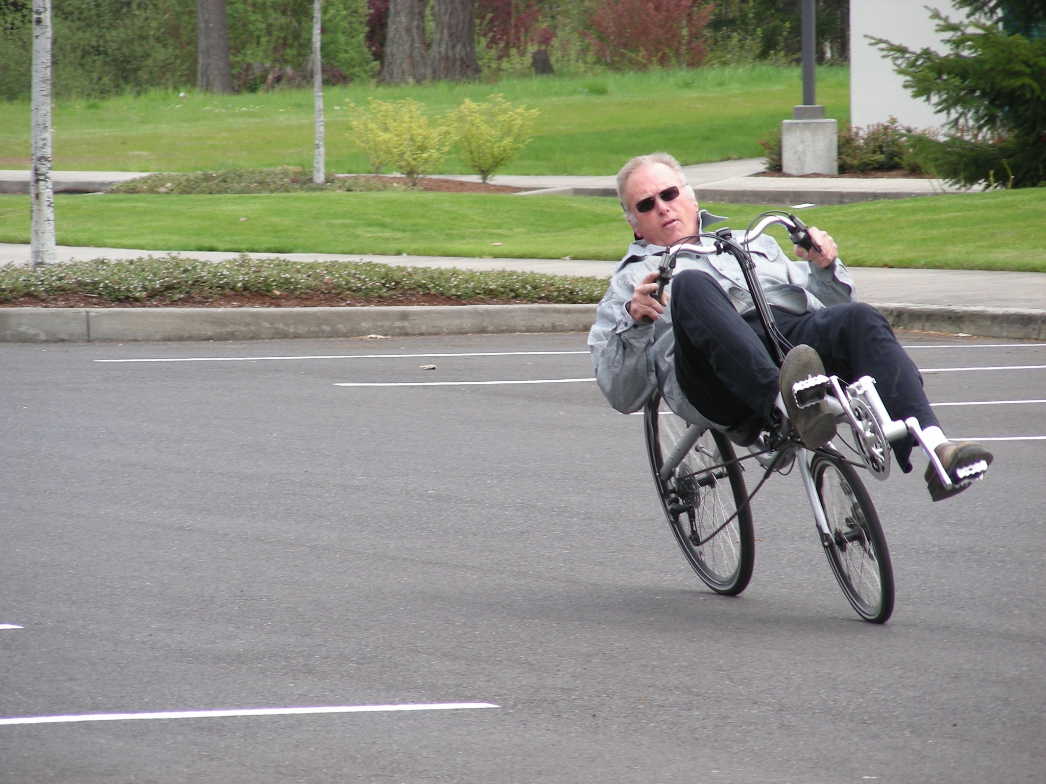 a man riding a bicycle with a person on the back