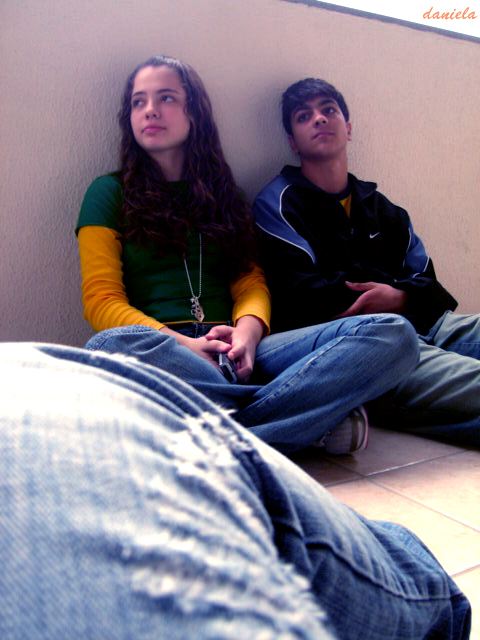 two young people laying next to each other