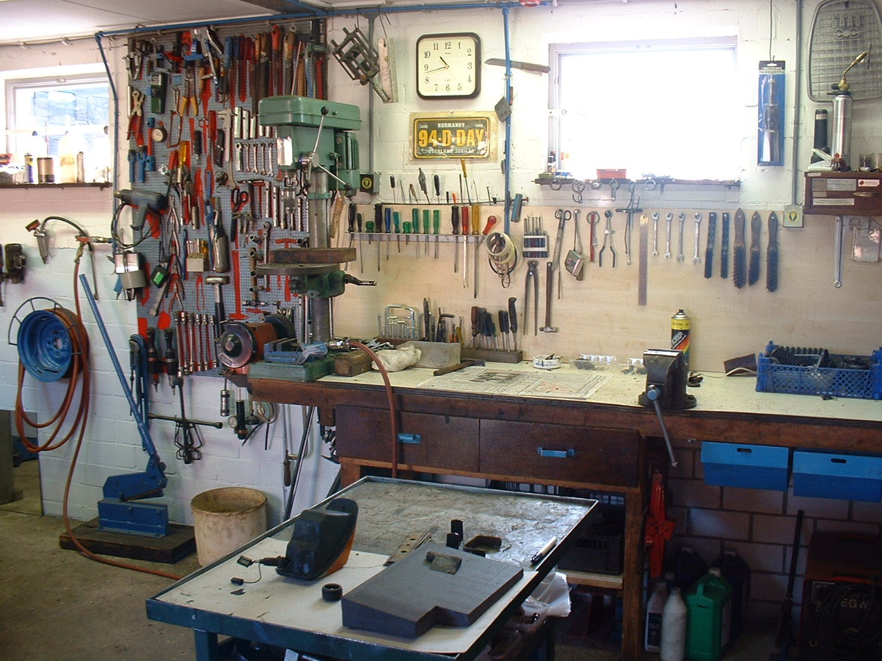 a garage with tools hung on the wall