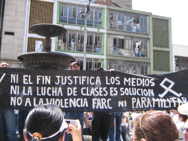 a protest in front of a building on the street