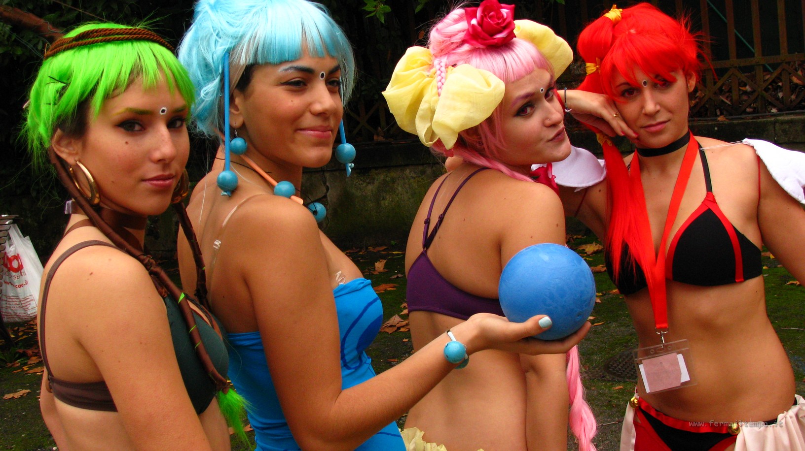 three  women with green and pink hair