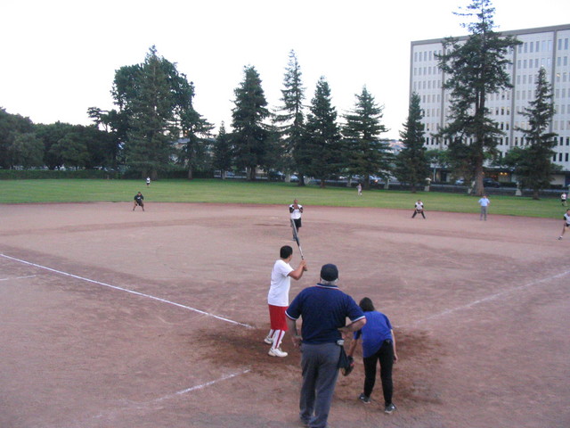 several people playing a game of baseball on a field
