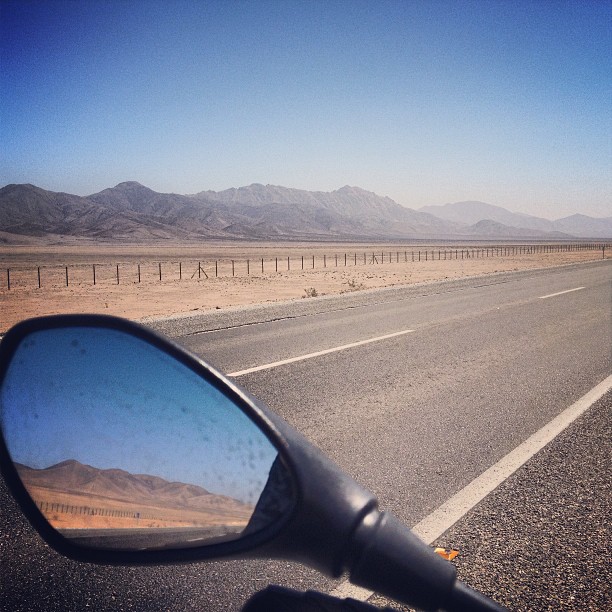 a motorcycle mirror on the side of the road