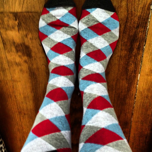 an overhead view of someones legs and feet with socks on