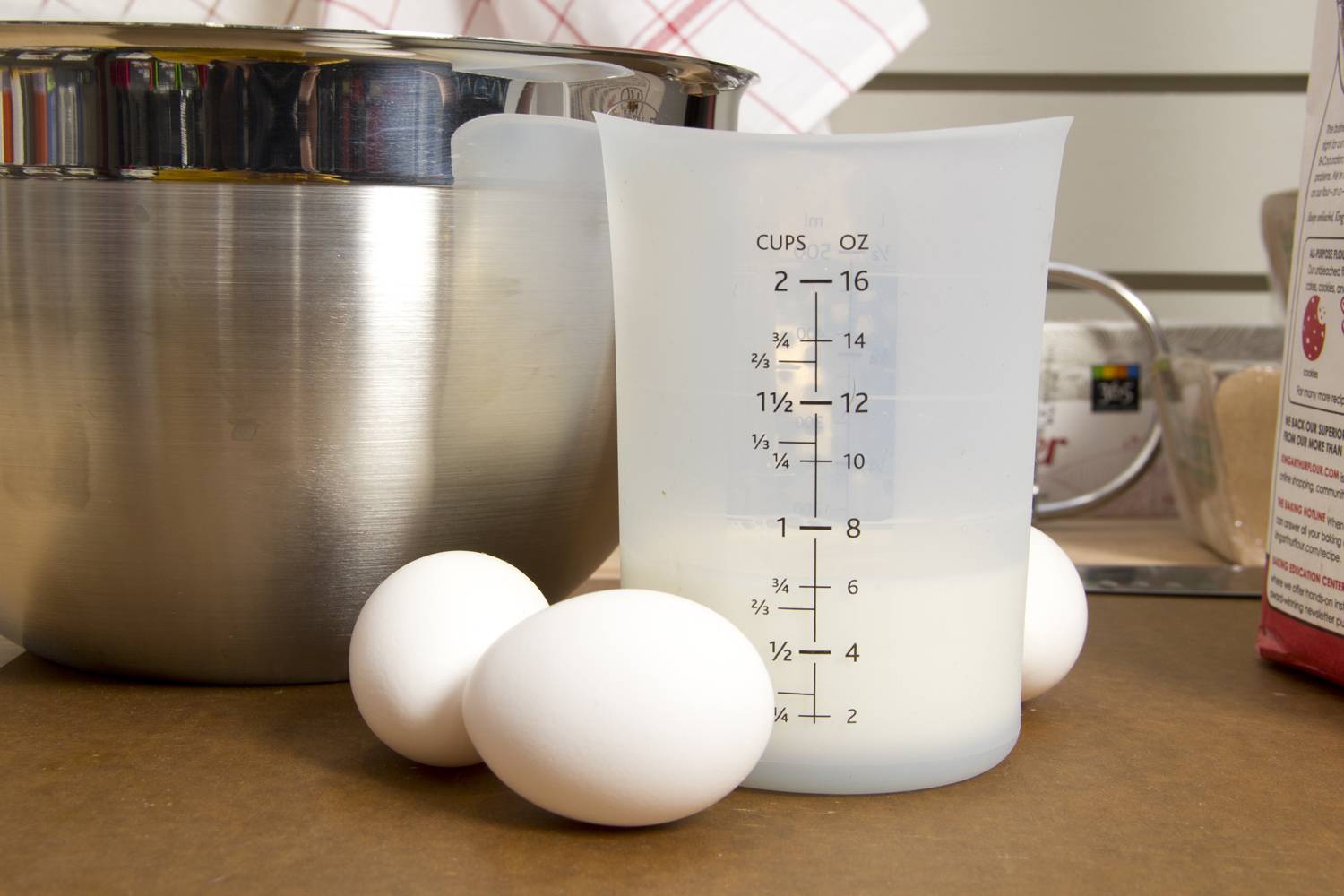 two eggs and measuring jug are on the counter