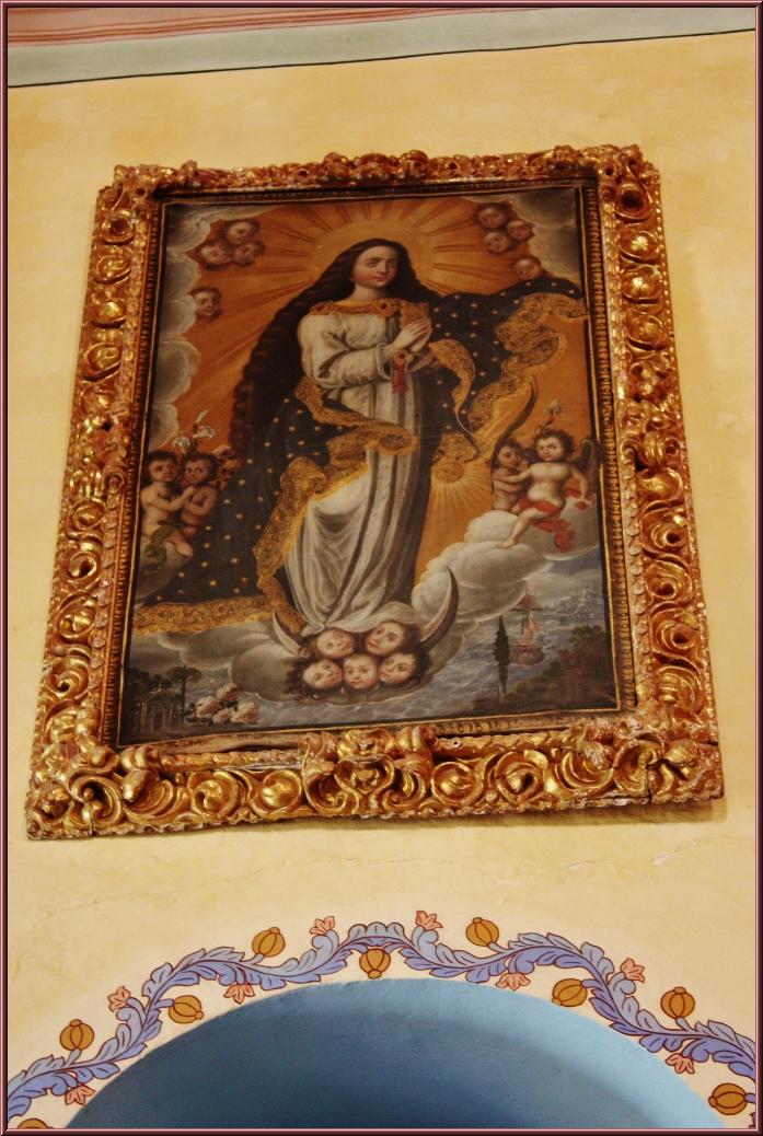 painting of the mother of jesus in a room