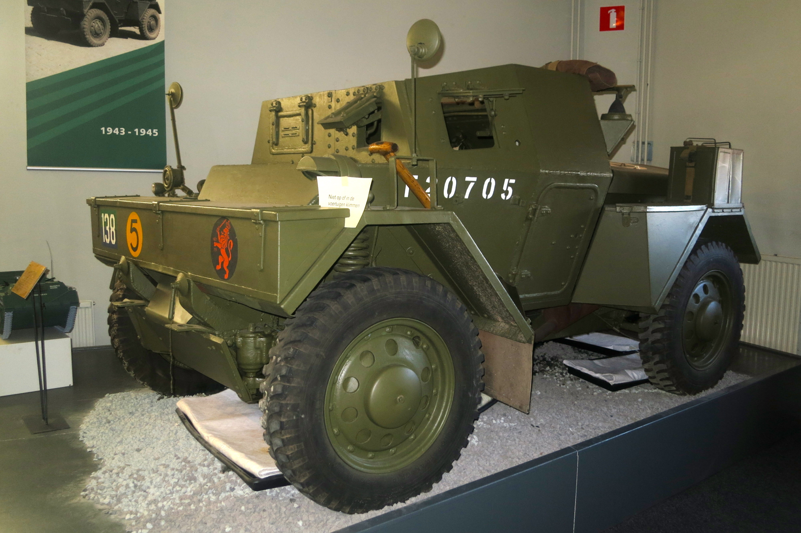 an army vehicle sits on display in the museum