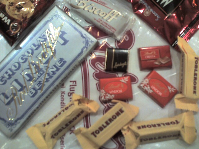 assorted chocolates and candy on plastic wrapper