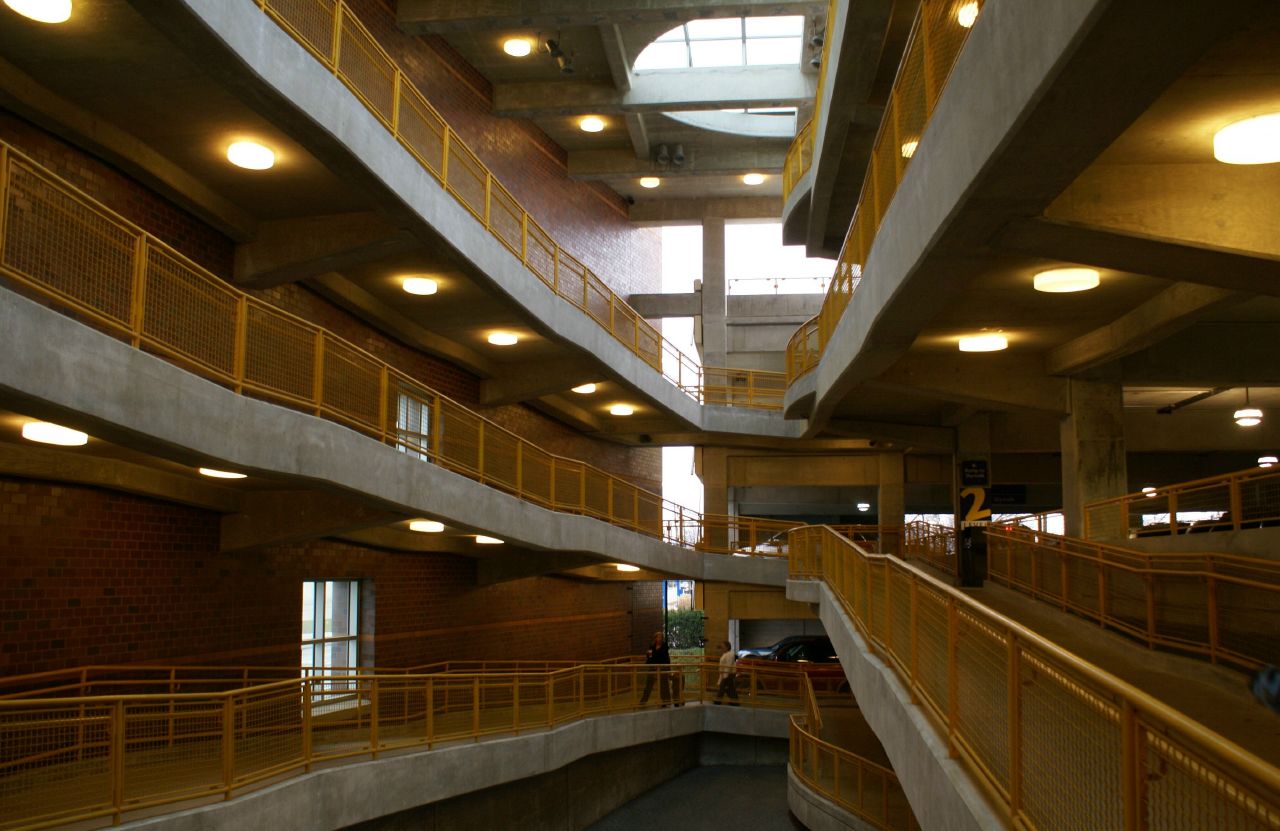 a hallway filled with lots of lights and windows