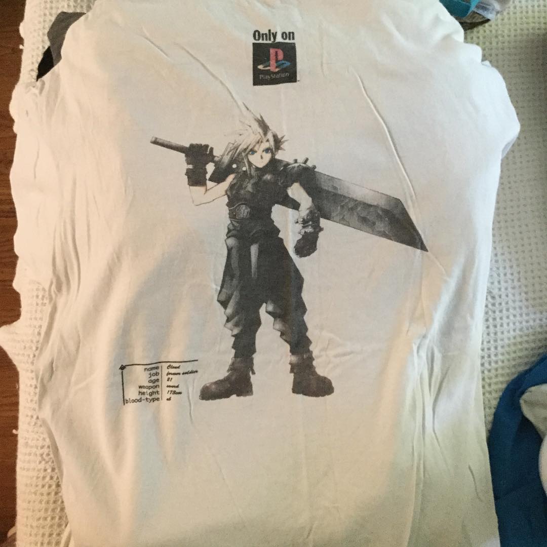 a shirt with a anime character holding a sword