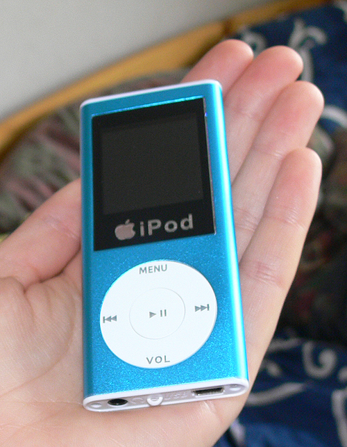 a ipod is being held in someone's hand