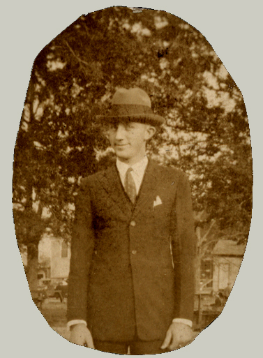 an old po of a man in suit and hat