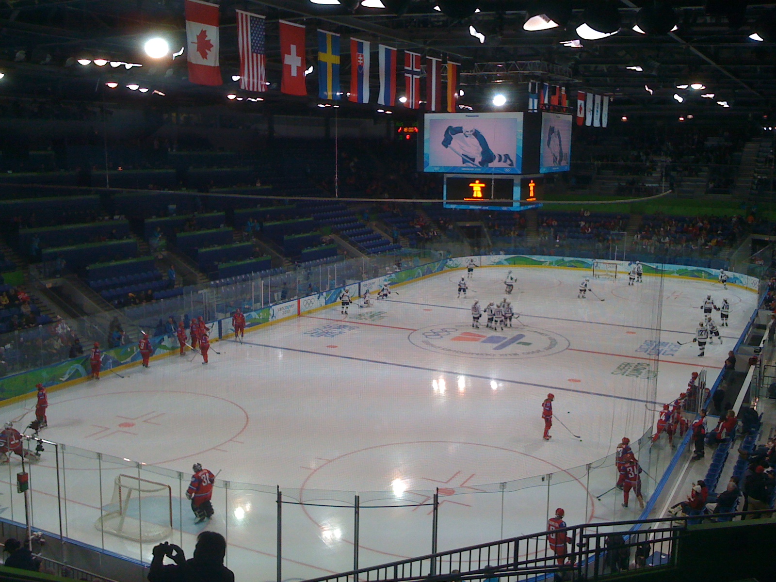 a large group of people in a hockey rink