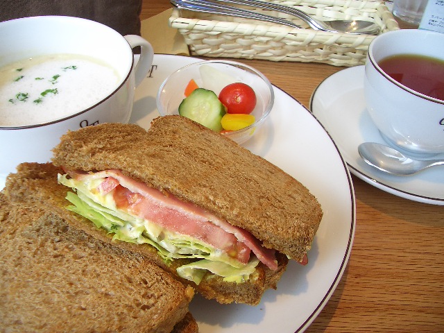 a close up of a plate of food with a sandwich